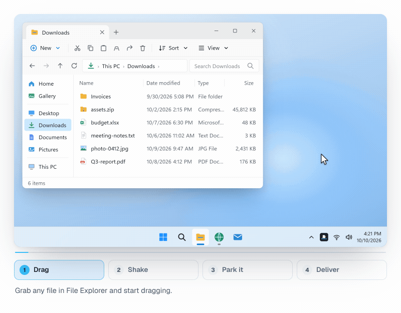 Windows のエクスプローラーでファイルをドラッグしながらマウスを振ると、カーソルの横に棚が現れる様子